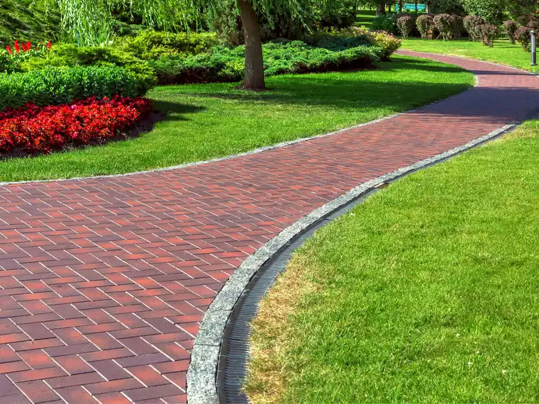 Sod being laid on a residential lawn in North Florida - professional installation with clean seams and proper grading